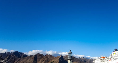 View of buildings against blue sky