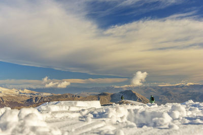 Scenic view of snowcapped mountains against sky