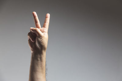 Midsection of person hand against white background