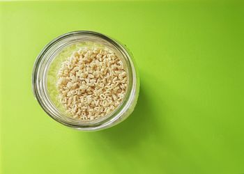 Close-up of food in bowl against green background