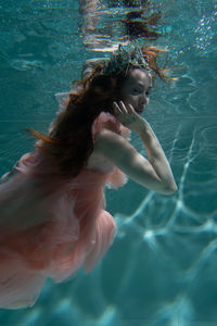 Woman swimming in pool