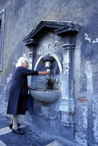 Man in front of building