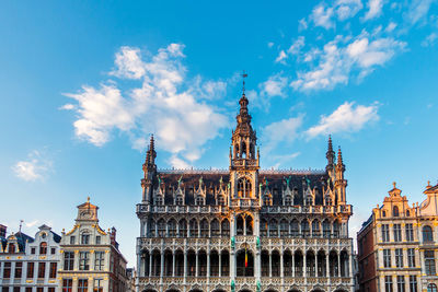 Low angle view of buildings against blue sky