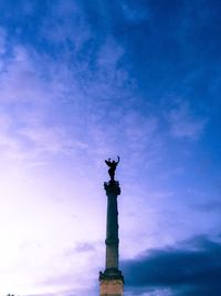 Low angle view of statue against blue sky