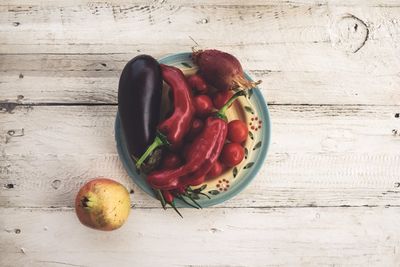 Close-up of red fruit on wood