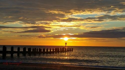 Scenic view of sea at sunset