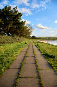 Empty road along countryside landscape