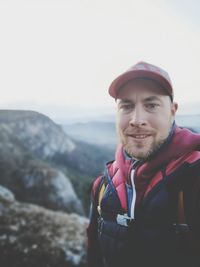 Portrait of man against mountains