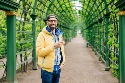 Full length of man standing on bridge