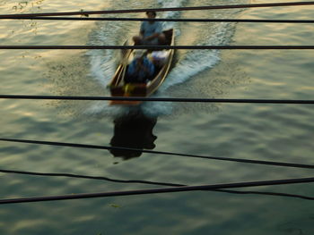 Reflection of man in water