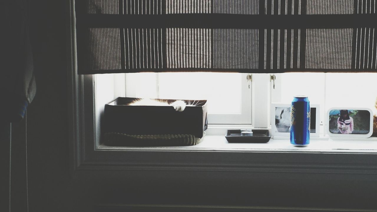 indoors, window, home interior, table, still life, absence, no people, chair, empty, domestic room, shelf, glass - material, day, reflection, close-up, house, domestic kitchen, book, stack, transparent