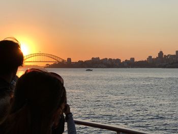 Rear view of woman on boat in city