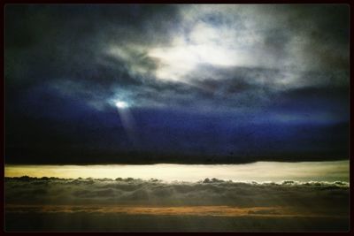 Scenic view of landscape against cloudy sky