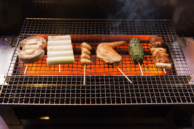 High angle view of meat on barbecue grill