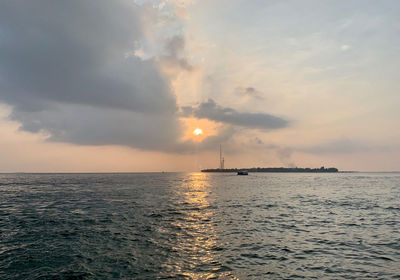 Scenic view of sea against sky during sunset