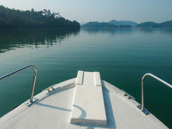 Boat sailing in lake against sky