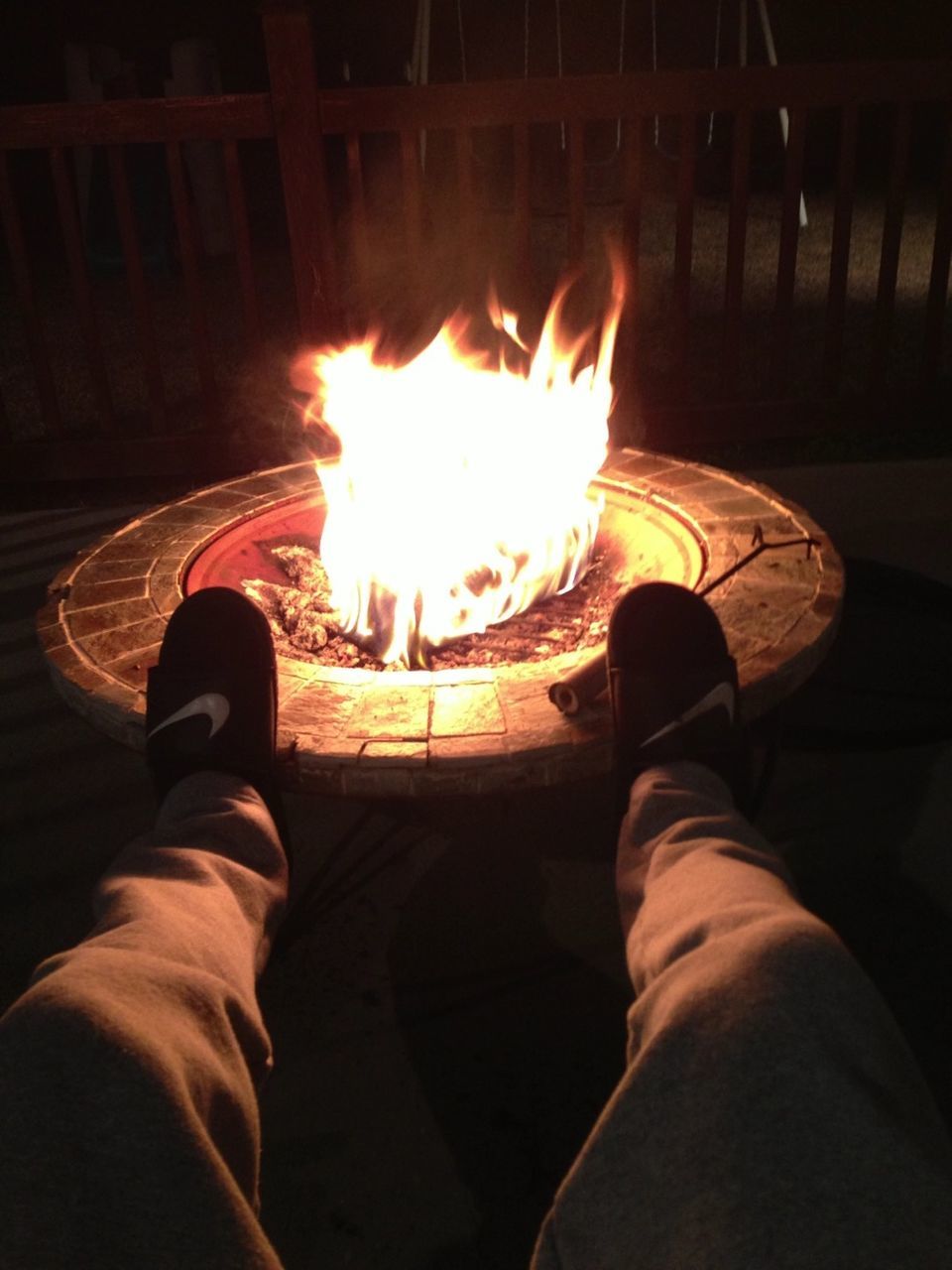 personal perspective, men, night, low section, lifestyles, person, flame, illuminated, leisure activity, fire - natural phenomenon, burning, shoe, unrecognizable person, standing, heat - temperature, part of, glowing