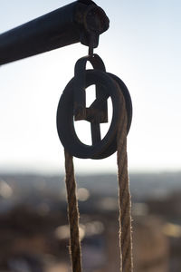 Close-up of cross against sky