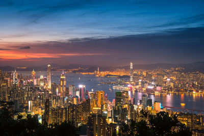 High angle view of city lit up at night