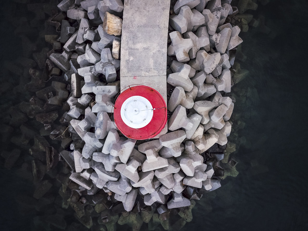 HIGH ANGLE VIEW OF TEXT WRITTEN ON METAL CONTAINER