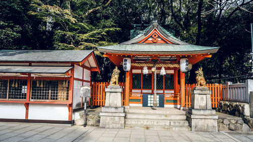 Entrance of temple against building