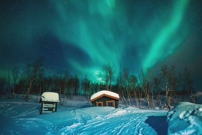 Scenic view of snow covered landscape at night
