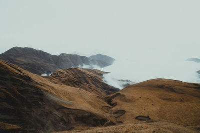 Road through the mountains and clouds