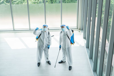 Two people working in corridor