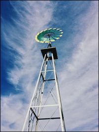 Low angle view of windmill against sky