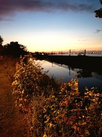 Scenic view of lake against sky during sunset