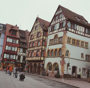 View of buildings in city against clear sky