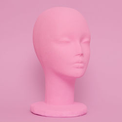 Close-up of statue against pink background