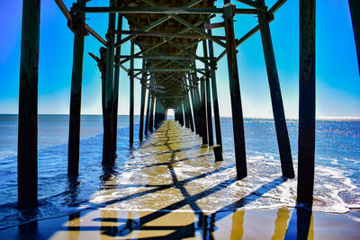 View of pier over sea against sky