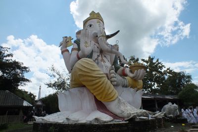 Low angle view of statue against sky