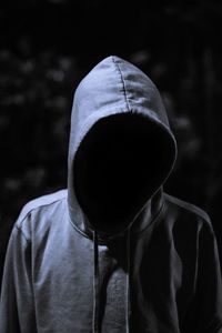 Invisible person wearing hooded shirt at night