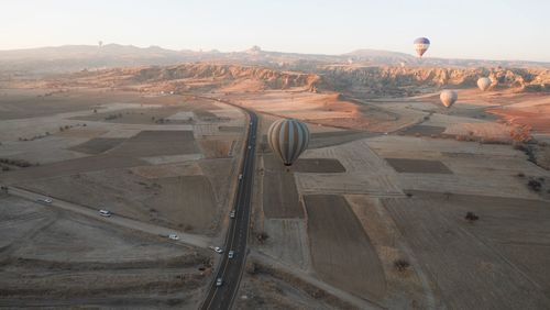 Aerial view of hot air balloon over landscape