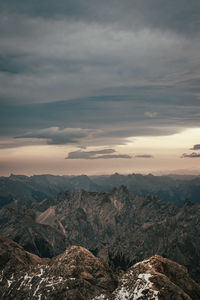 Scenic view of dramatic landscape against sky during sunset