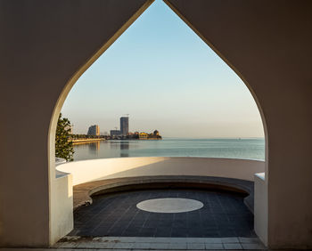 View of sea seen through arch against sky