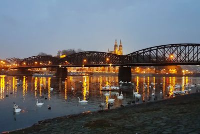 Bridge over river at dusk