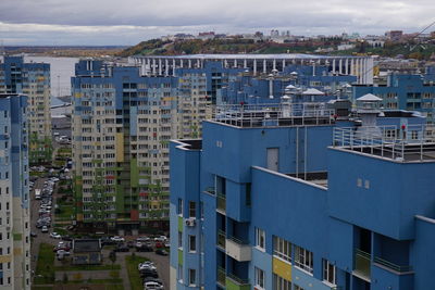 High angle view of buildings in city against sky