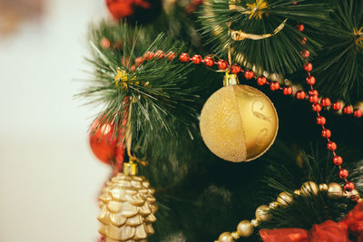 Close-up of christmas decorations hanging on tree