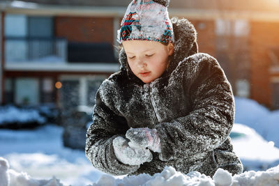 Girl in warm clothing during winter