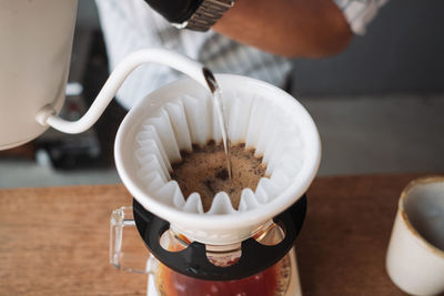 Barista dripping coffee and slow coffee bar style