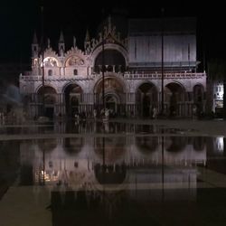 Reflection of illuminated built structure in water