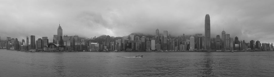 City skyline against cloudy sky