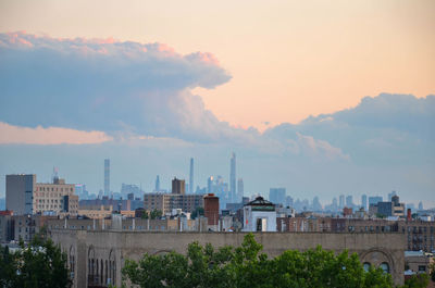 View of buildings against cloudy sky