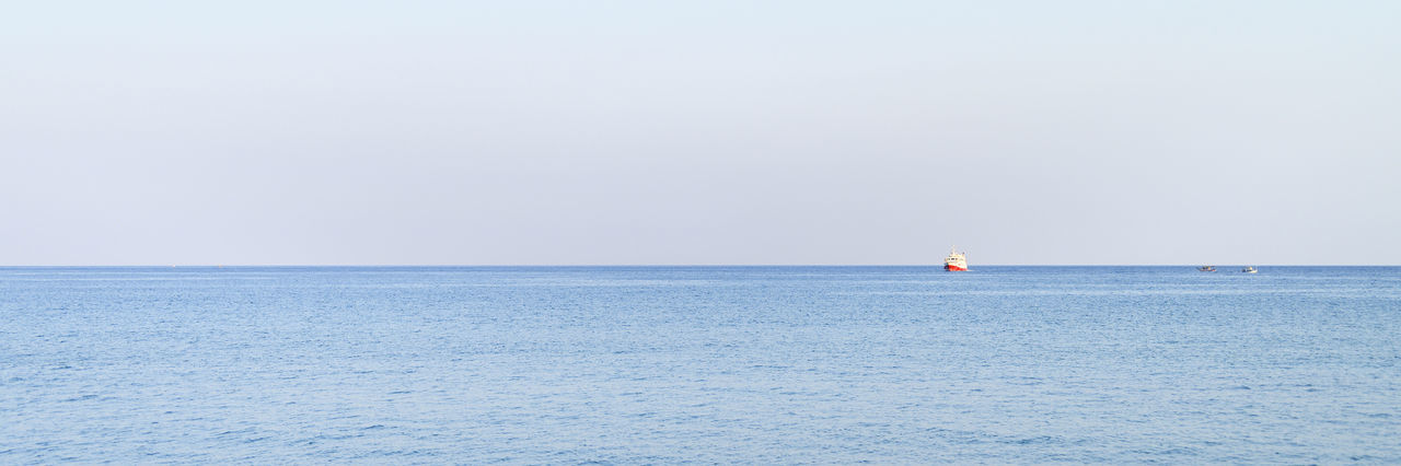 SCENIC VIEW OF SEASCAPE AGAINST CLEAR SKY