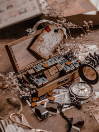 High angle view of stamp box with love letter on the table