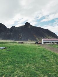 Scenic view of mountains at stykkisholmur against cloudy sky