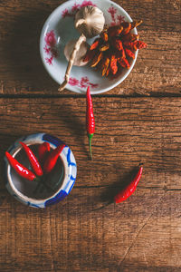 High angle view of red chili peppers on table